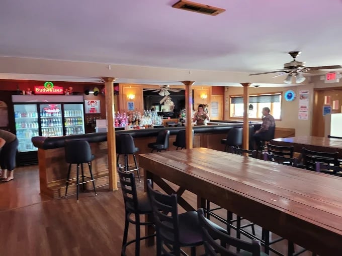 Interior of Hideout Bar with wooden counter and bar stools